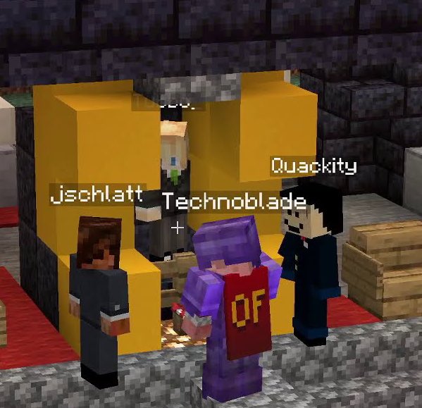 A cropped screenshot from Tommy's stream. It shows Tubbo held in place by yellow concrete in the center of the stage. Quackity stands to the right of Tubbo and Schlatt to the left. Techno stands in front of Tubbo, decked out in purple netherite armor and holding a firework.